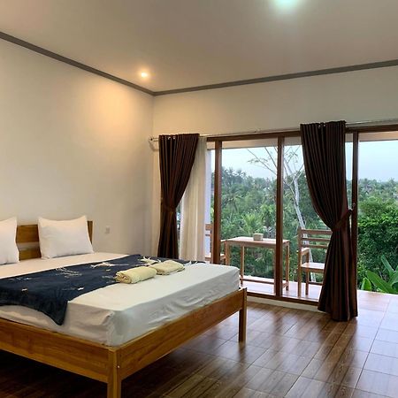 Tommy Homestay Plambi Номер фото